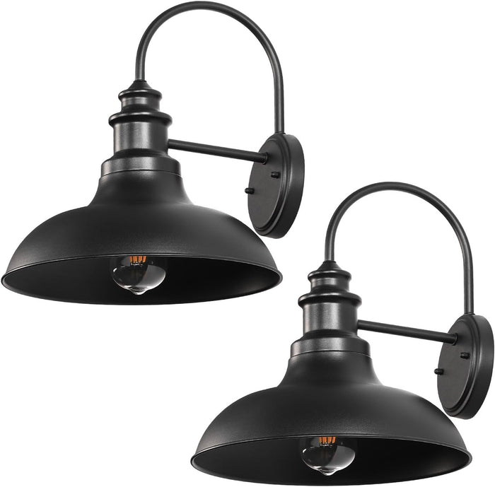 Two black wall-mounted barn-style lights on a white background