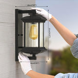 Person installing an outdoor wall light fixture with dimensions displayed.
