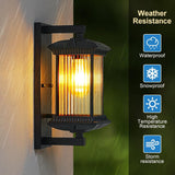 Outdoor wall light fixture with weather resistance features on a dark background
