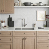 Kohler Lir Stainless Steel Kitchen Faucet on a quartz countertop with beachwood cabinets