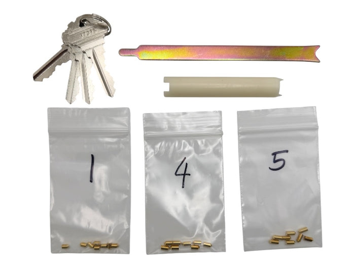 Schlage rekey kit including keys, follower, clip removal tool, and pins on a white background