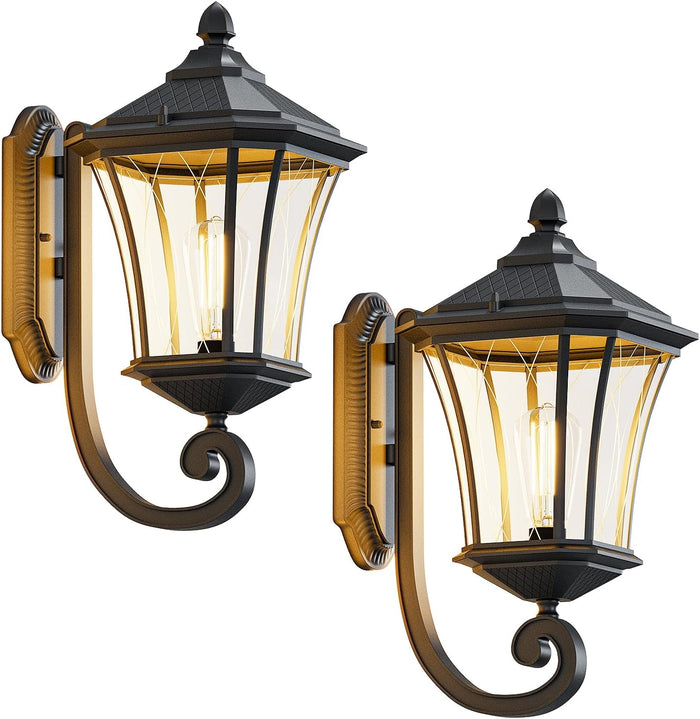 Pair of decorative outdoor wall lights with black and gold finish on a white background