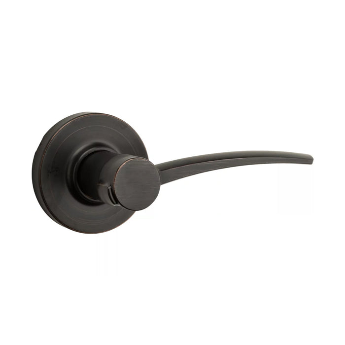A single Kwikset Katara Venetian Bronze Passage door handle with a lever and round rosette.