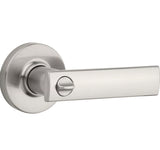 A satin nickel finish door handle with a keyhole, part of the Vedani collection.