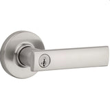 A satin nickel finish door handle with a keyhole, part of the Vedani collection.