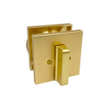 Interior view of satin brass deadbolt on white background