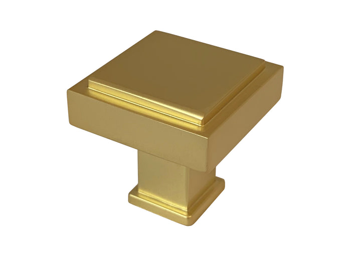 A satin brass square cabinet knob.