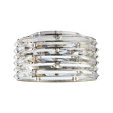 A polished chrome light fixture with a curved crystal accent shade and a reflective surface.