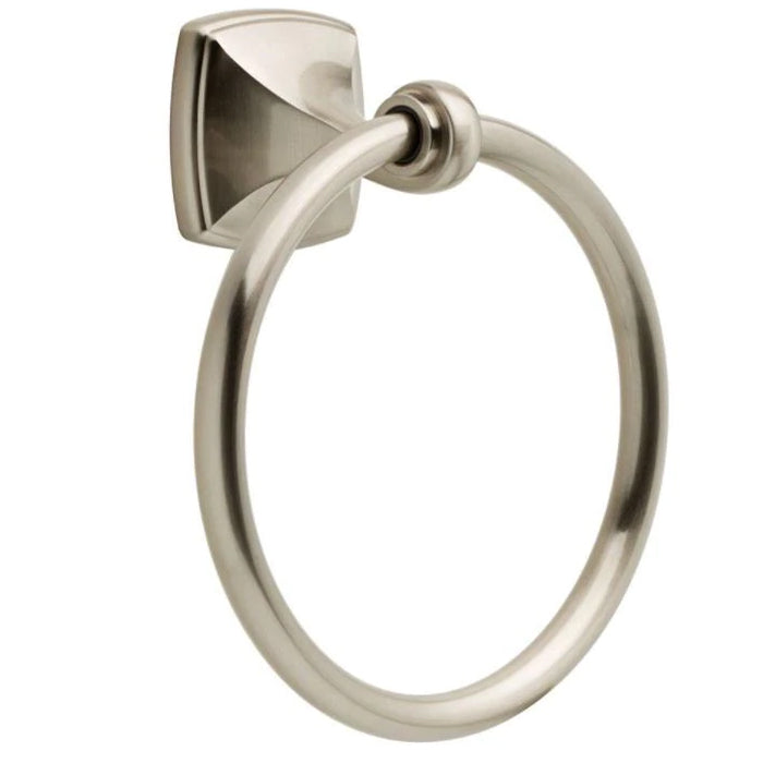 A satin nickel towel ring with an elegant, ocean-inspired wave design, mounted on a wall.