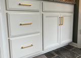 Satin Brass Cabinet pulls on white cabinetry
