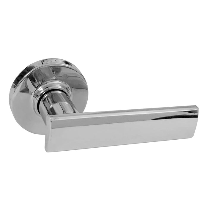 A polished chrome finish door handle from the Vedani collection by Kwikset, featuring a lever design with round rosettes.