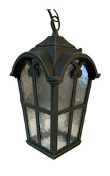Outdoor hanging light fixture with a verdigris finish and textured glass panels, designed in a Victorian style with an adjustable hanging chain.