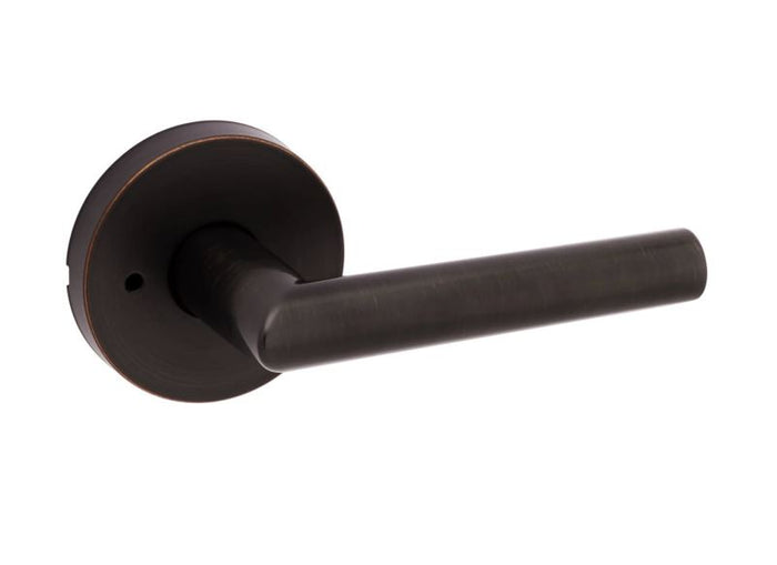 A Venetian bronze round privacy door lever from the Kwikset Milan Collection.