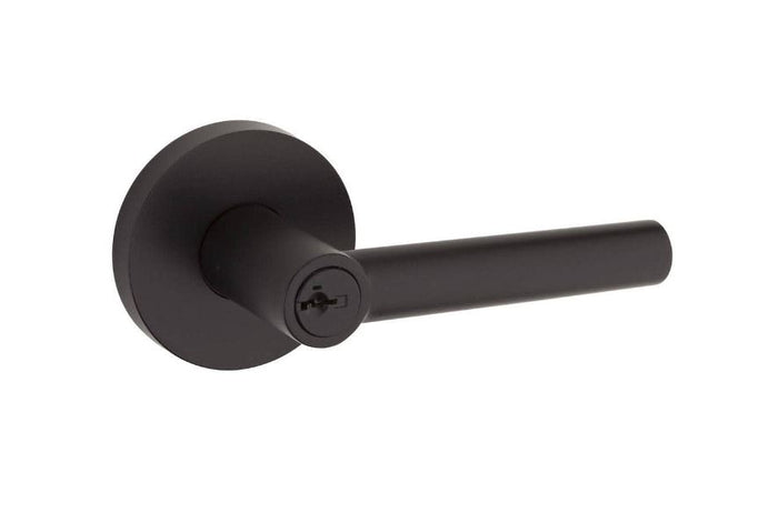 Matte black round entry door lever with SmartKey security feature.