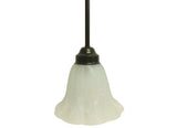 A single light pendant with a dark oil rubbed bronze finish and white alabaster glass, with visible wiring at the top.