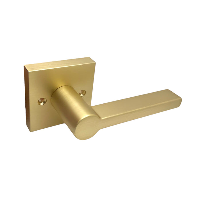 A satin brass modern square dummy door lever handle.