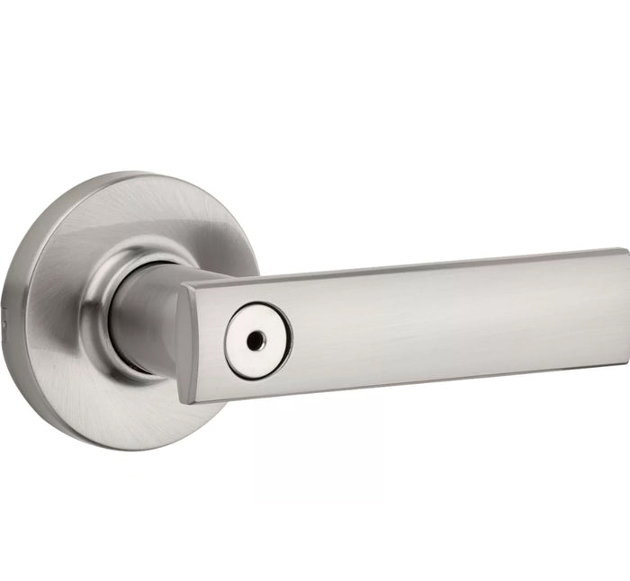 Satin nickel finish privacy door handle with round rosettes and a keyhole in the center.