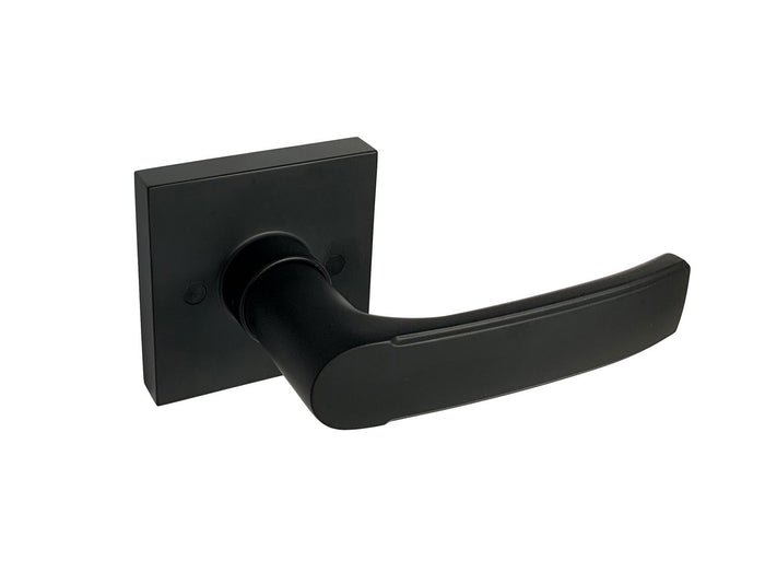 Matte black square dummy door handle mounted on a door
