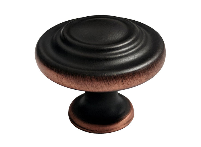 A dark oil rubbed bronze round cabinet knob.