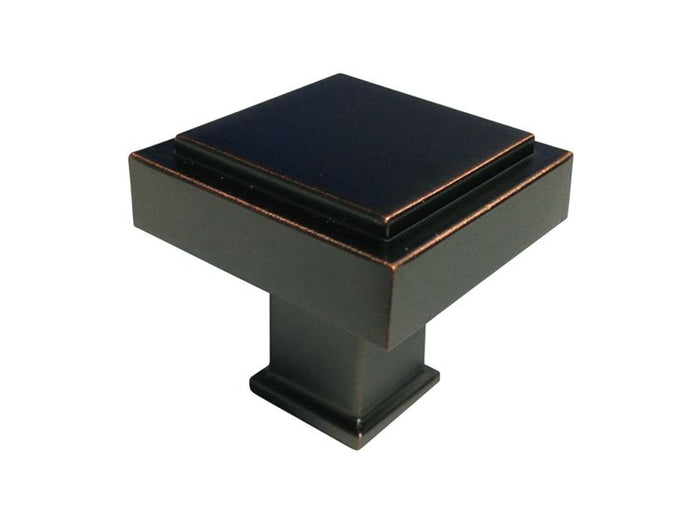 A dark oil rubbed bronze square kitchen cabinet knob.