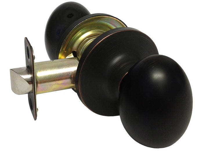 Dark oil rubbed bronze passage oval knobs with a metallic rose and a keyhole, installed on a door frame.