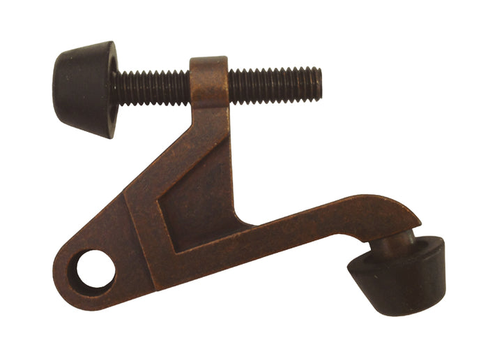 A rustic bronze hinge mount door stopper.