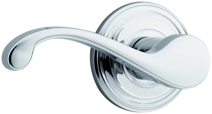 A polished chrome dummy lever door handle from Kwikset's CommonWealth collection.